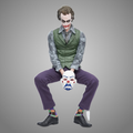 The Joker sitting statue holding a clown mask, 15 cm PVC collectible figure on gray background